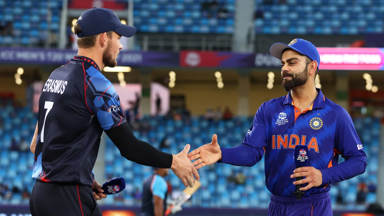 Gerhard Erasmus and Virat Kohli greet each other at the toss