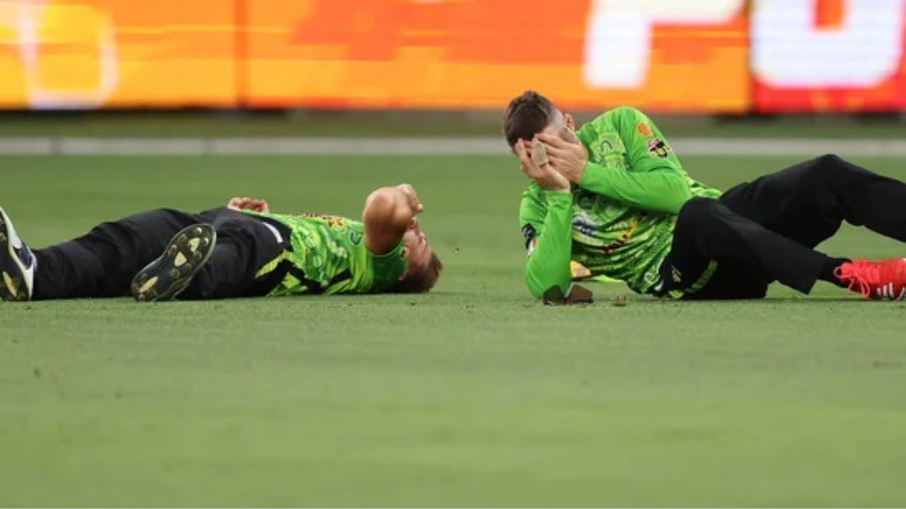 Daniel Sams And Cameron Bancroft Lie On The Ground