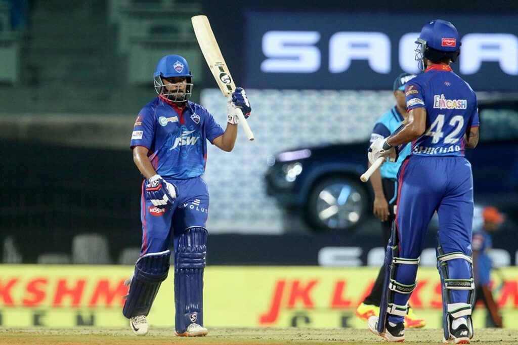 Prithvi Shaw of Delhi Capitals raises his bat after scoring a fifty. (Photo- BCCI)