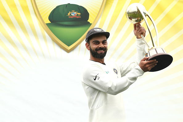 SYDNEY, AUSTRALIA - JANUARY 07: Virat Kohli of India holds aloft the Border–Gavaskar Trophy during day five of the Fourth Test match in the series between Australia and India at Sydney Cricket Ground on January 07, 2019 in Sydney, Australia. (Photo by Mark Metcalfe - CA/Cricket Australia/Getty Images)