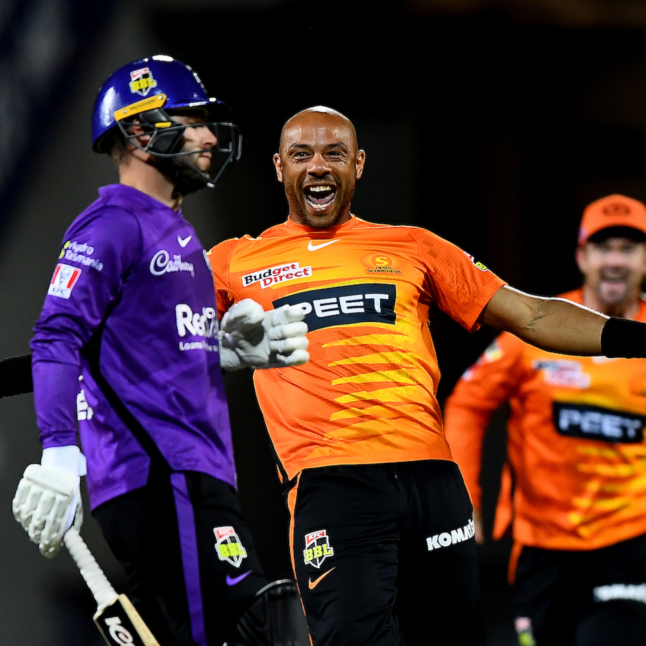 HOBART, AUSTRALIA - DECEMBER 14: Tymal Mills of the Scorchers celebrates the wicket of Caleb Jewell of the Hurricanes during the Men's Big Bash League match between the Hobart Hurricanes and the Perth Scorchers at Blundstone Arena, on December 14, 2021, in Hobart, Australia. (Photo by Steve Bell/Getty Images)