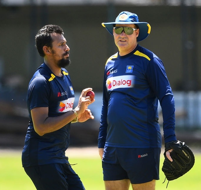 Sri Lankan cricketer Suranga Lakmal and Mickey Arthur. (Photo by ISHARA S. KODIKARA / AFP)