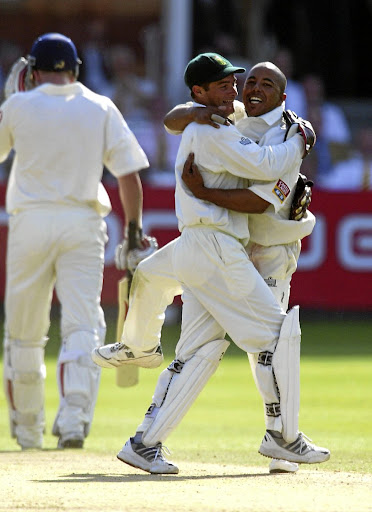 LONDON - AUGUST 3, 2003: Paul Adams of South Africa and Mark Boucher of South Africa. (Photo By Stu Forster/Getty Images)