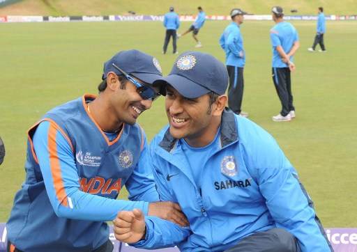 India's Dinesh Karthik (L) and Mahendra Singh Dhoni (R). PHOTO- AFP / Prakash SINGH 