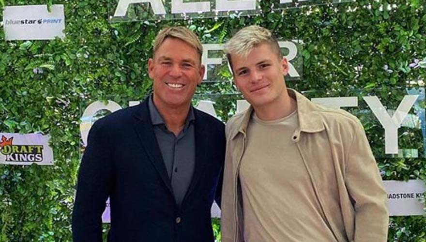 Shane Warne with his son