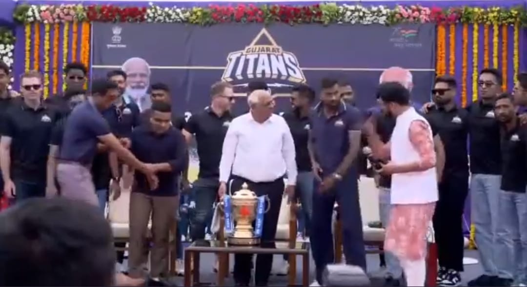 Watch- Gujarat Titans' Member Pulls Shy Ashish Nehra To Stand Beside Gujarat CM As Head Coach Tries To Stay Away From Spotlight