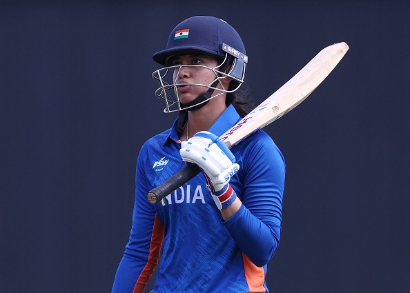 India's Smriti Mandhana returns to the dressing room after losing her wicket during the women's Twenty20 Cricket semi-final match between India and England on day nine of the Commonwealth Games at Edgbaston in Birmingham, central England, on August 6, 2022. (Photo by Darren Staples / AFP) (Photo by DARREN STAPLES/AFP via Getty Images)