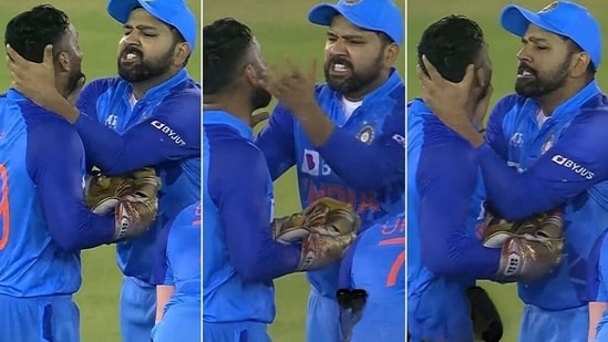 Rohit Sharma and Dinesh Karthik share a light-hearted moment during the first T20I against Australia in Mohali.