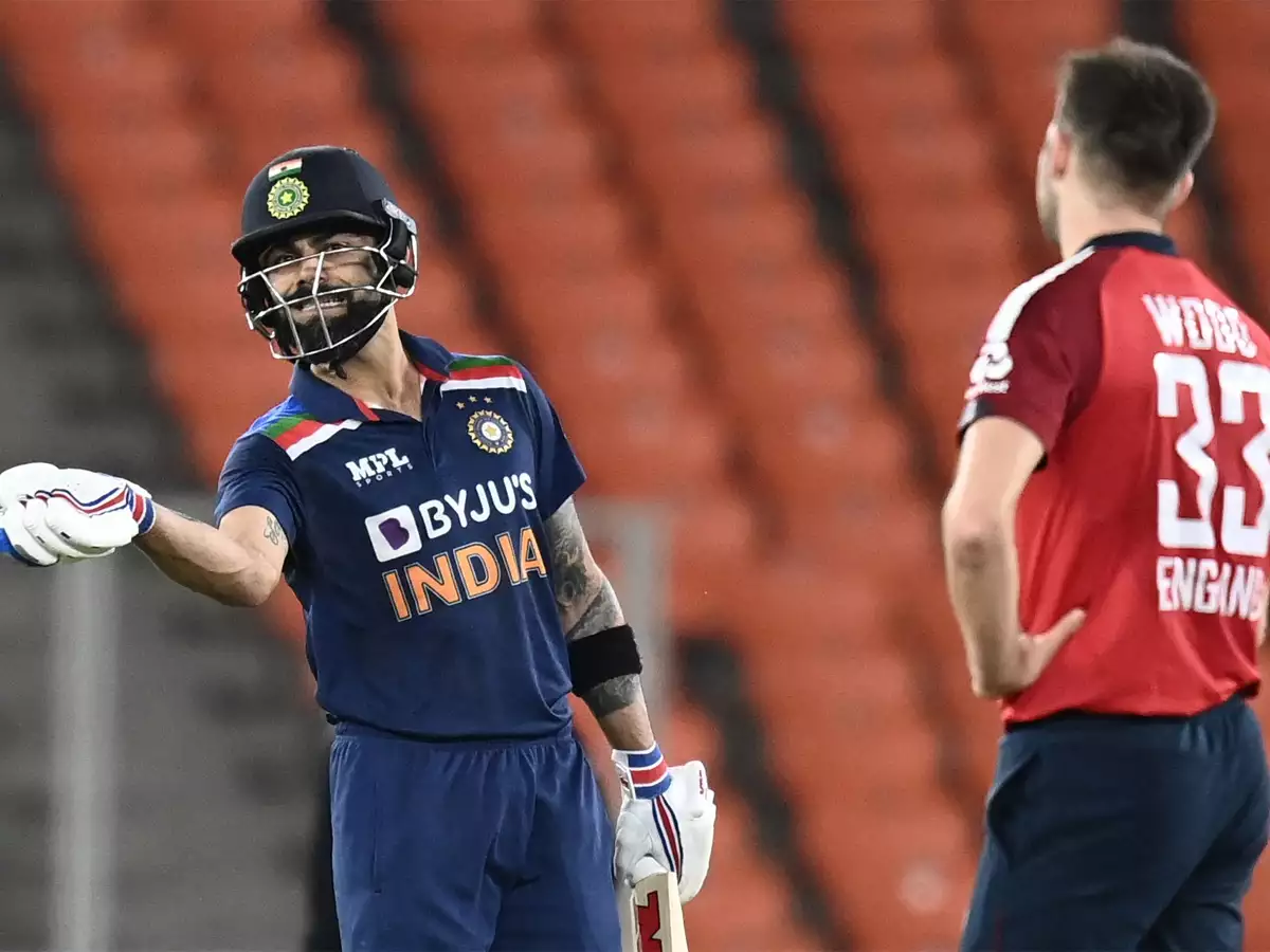 Virat Kohli and Mark Wood