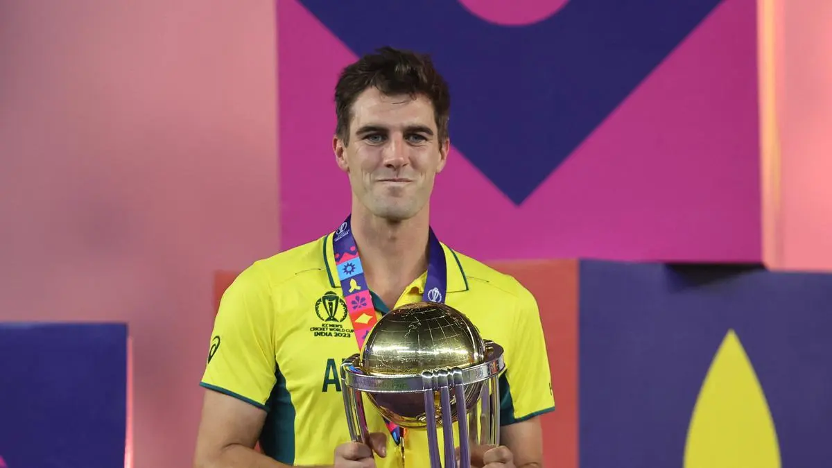 Pat Cummins Holding the ODI World Cup Trophy